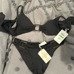 New with tags Becca black 2 piece bathing suit. Size large